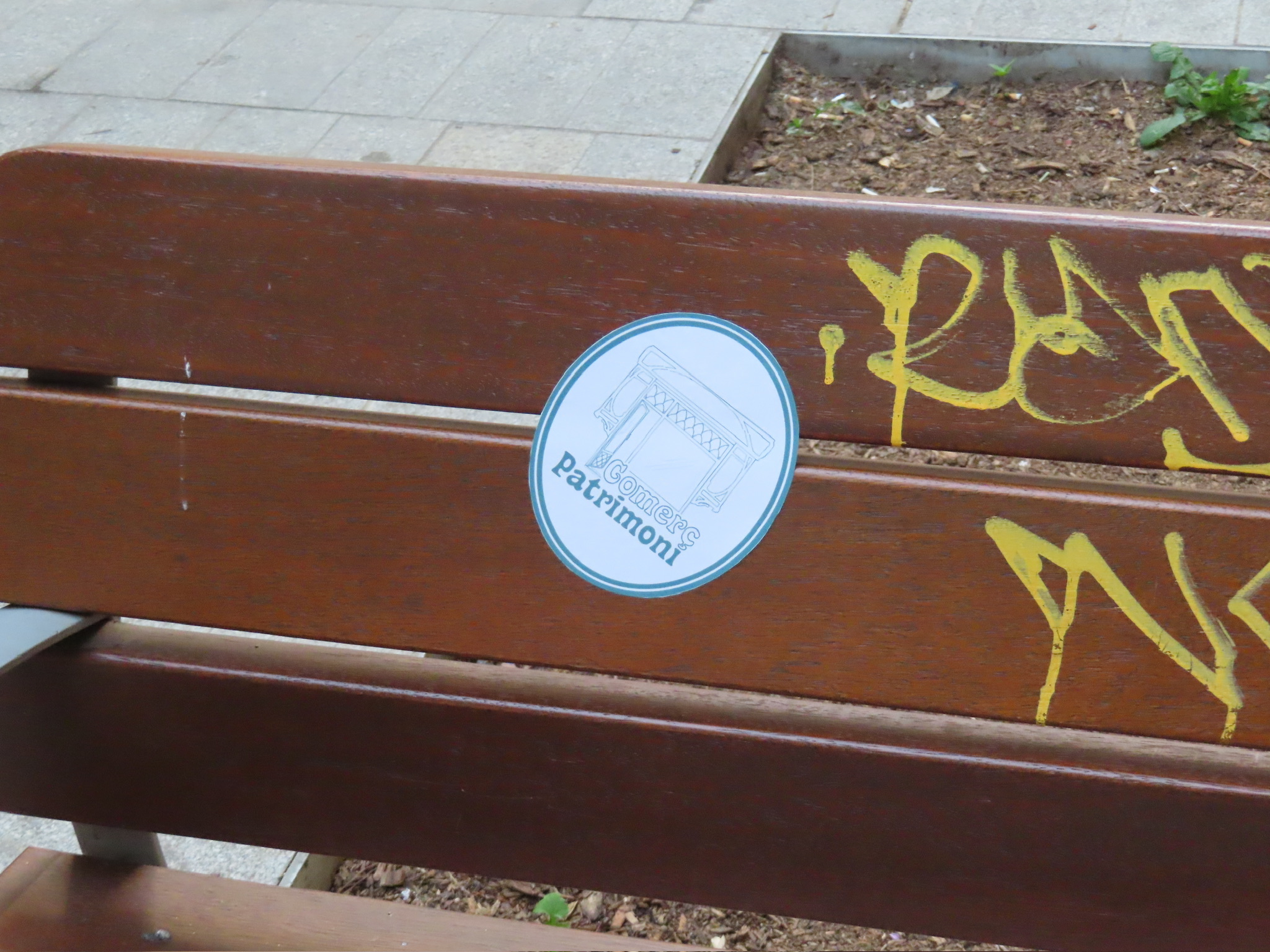 a sticker on a bench